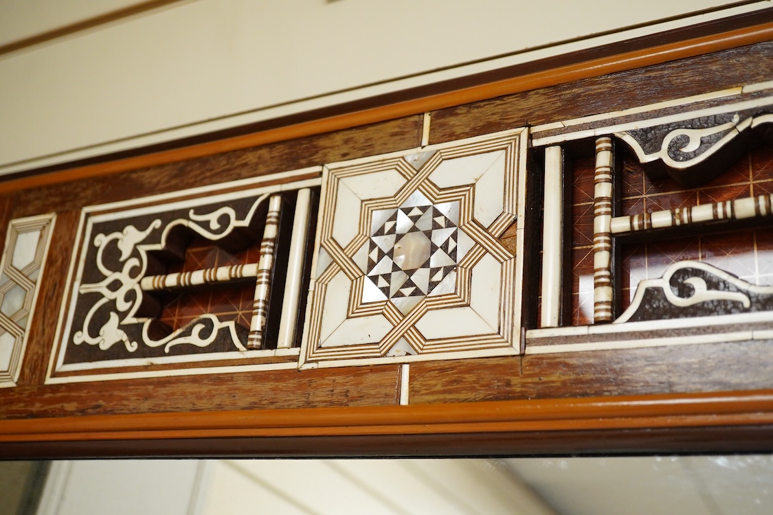 A Moroccan bone and abalone inlaid wall mirror